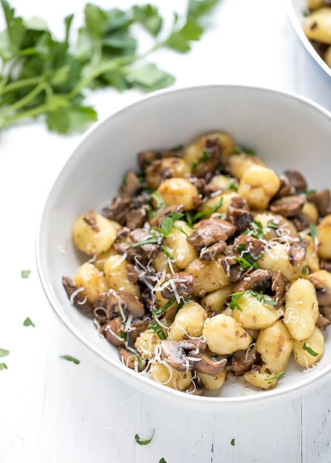 a bowl with gnocchi with mushrooms